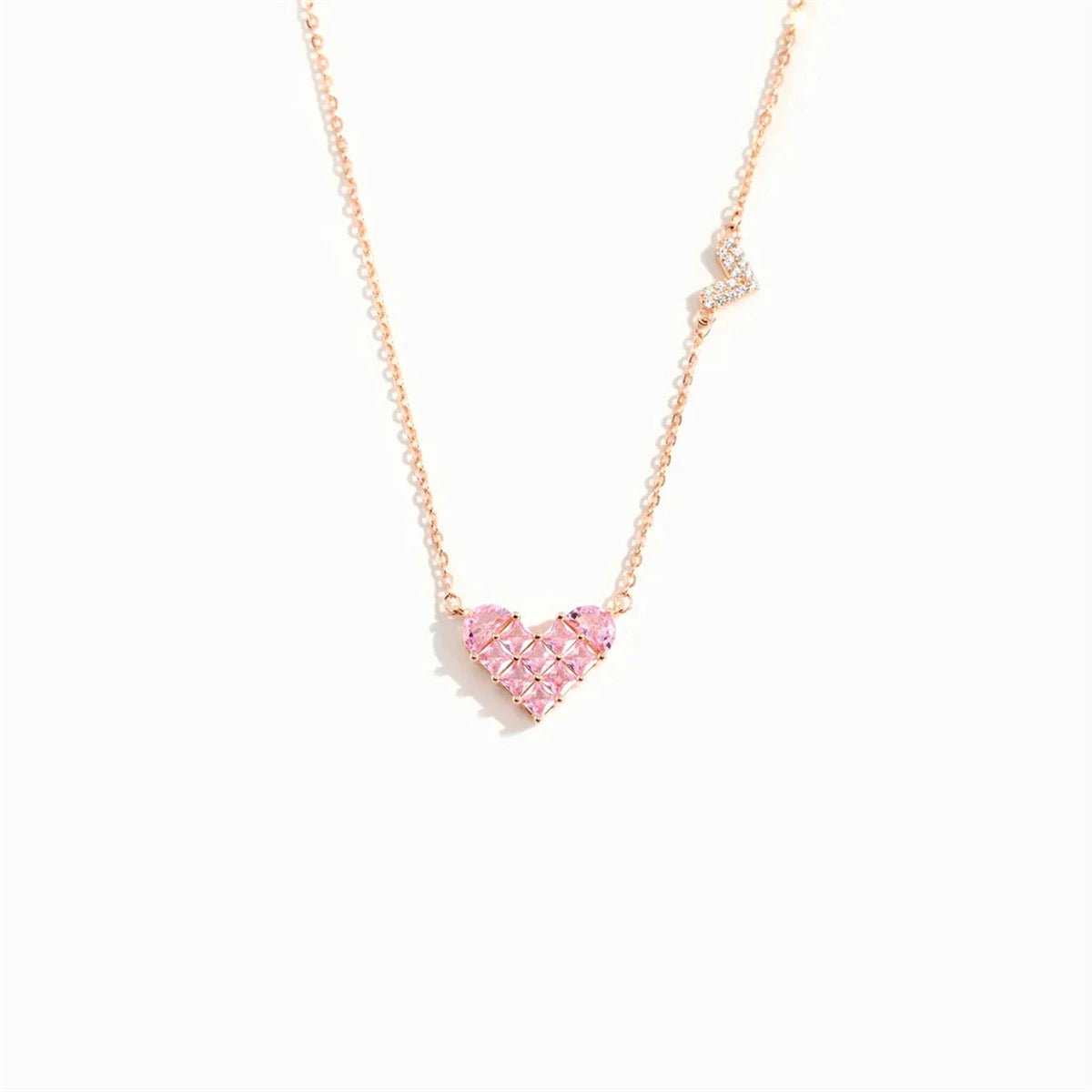 Collier cœur avec un petit pendentif de cœur rose