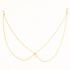 Collier de dos avec un petit pendentif en forme de boule blanche