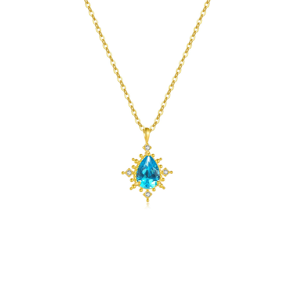 Collier bleu avec un pendentif très lumineux et une chaîne dorée 