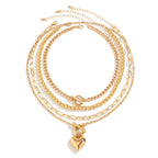 Collier multi rangs avec pendentif en forme de cœur doré 