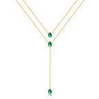 Collier vert avec une chaîne dorée et petites boules vertes 