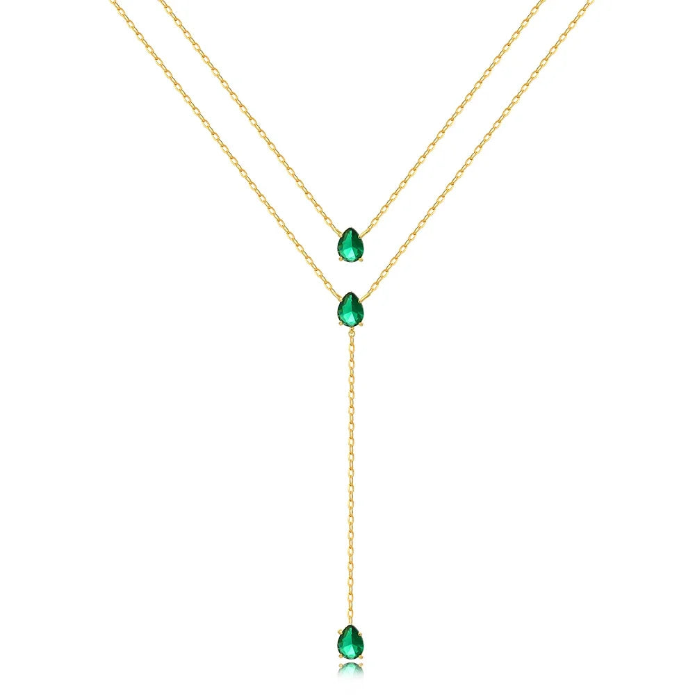 Collier vert avec une chaîne dorée et petites boules vertes 