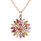 Collier fleur de couleur rose avec pendentif en forme de mosaïque de plusieurs couleurs 