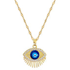 Collier œil doré avec pendentif en forme d’œil bleu 