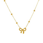 Collier minimaliste avec pendentif en forme de noeud doré 
