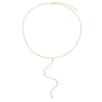 Collier en y avec une chaîne dorée composée de petites boules blanches