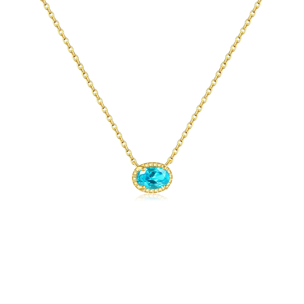 Collier bleu avec chaîne dorée et pendentif circulaire très discret 